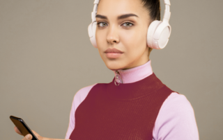 Portrait of female on phone wearing headphones